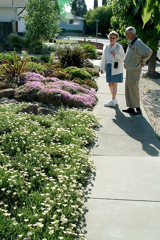 Willard and Margaret Elsberry in a garden walkway